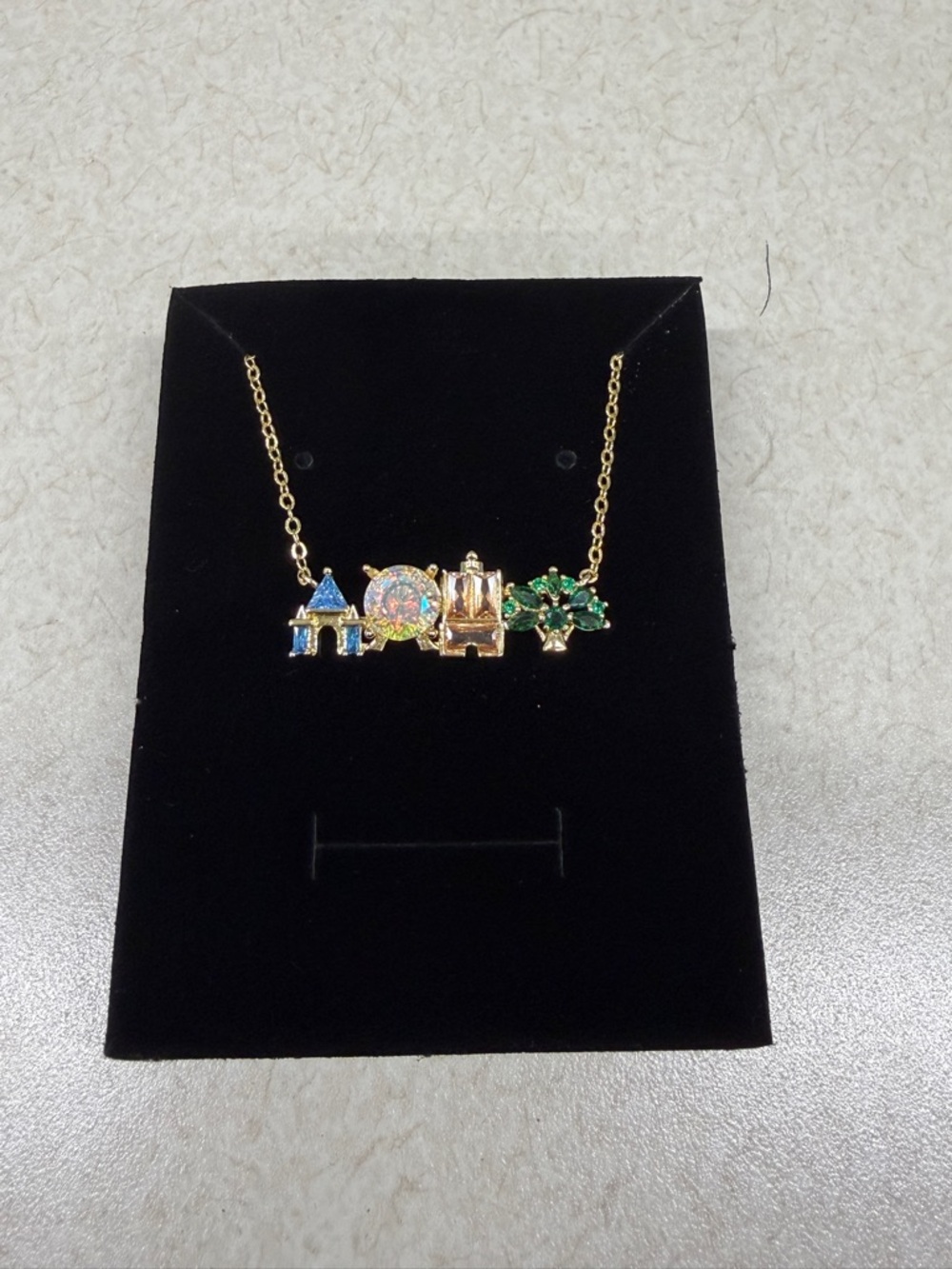 Gold-tone disney four theme parks inspired necklace